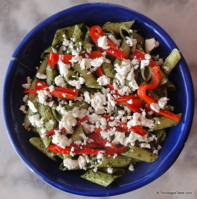 Pasta with pesto, roasted peppers, and feta